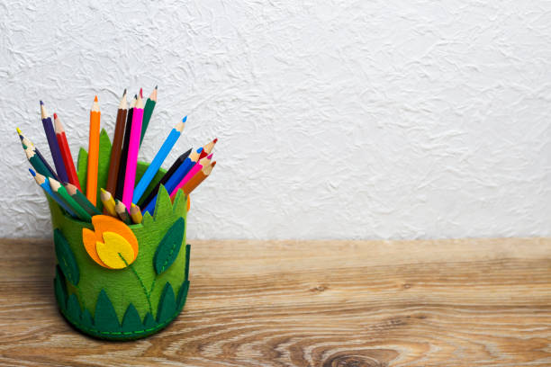 istock DIY fabric pencil holder. Office on a wooden table. 1309052659