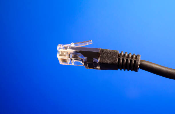 istock Power cord on a blue background. Internet wire. 1309052714