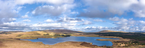 Panoramic drone view of a Scottish loch The view from a drone of a Scottish loch on a calm winter day the location is Dumfries and Galloway south west Scotland the panorama was created by merging several images Galloway Hills stock pictures, royalty-free photos & images