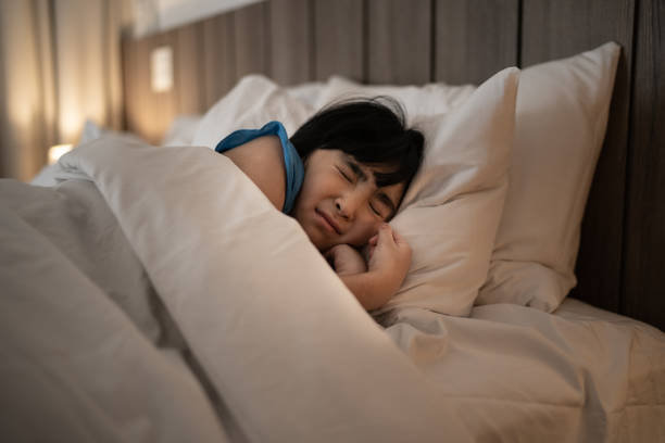 istock Girl sleeping having a nightmare 1309054088