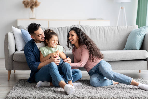 istock Middle Eastern Parents Having Fun With Their Little Daughter At Home 1309054514