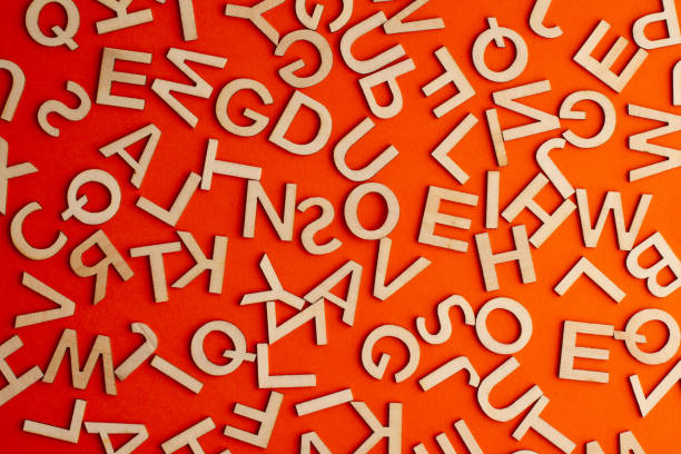 istock wooden cut alphabet letters on orange background 1309055064