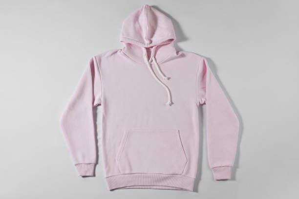 istock Casual pink hoodie on light background 1309057584