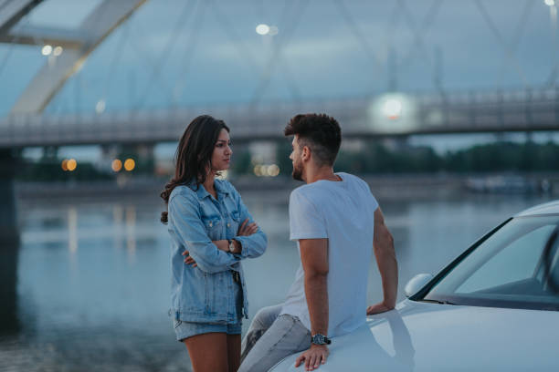 istock An affectionate young couple bonding together outdoors 1309057743