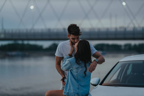 istock An affectionate young couple bonding together outdoors 1309057791