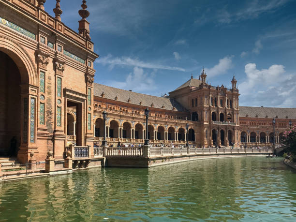 Beautiful perspective of the building and artificial lake of the Plaza de España in Seville stock photo