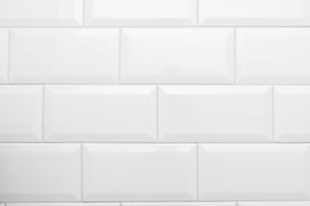 Part of a white glossy brick wall