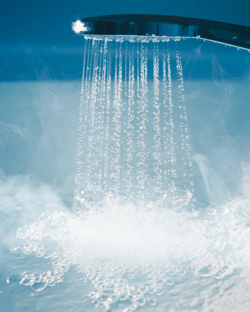 istock douche with flowing water and steam 1309061543