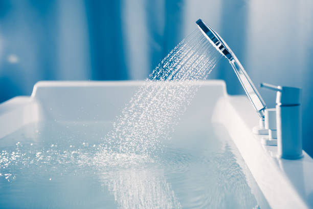 istock shower filling a bathtub with water stream 1309061548