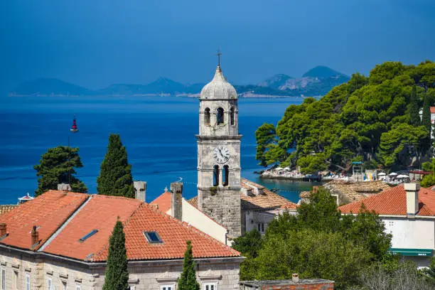 View of the church tower and the bay in Cavtat, Croatia.