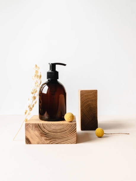 istock Brown bottle mockup for bathing products on wood podium 1309065043