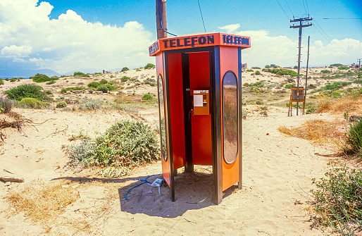Lonely telephone box in the desert.