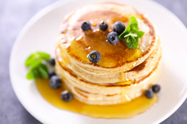 istock stack of pancakes with blueberries and syrup 1309067360