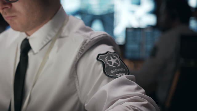 Close-up of the security service patch on the sleeve of a security officer.