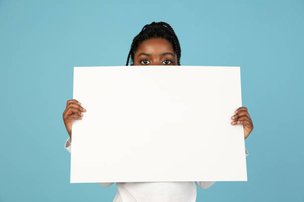 istock Handsome african little girl portrait isolated on blue studio background with copyspace 1309070786