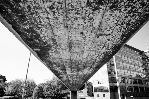 Leeds England 15.05.2018: Leeds North England Brutalist architecture. The underside of an imposing overpass in black and white
