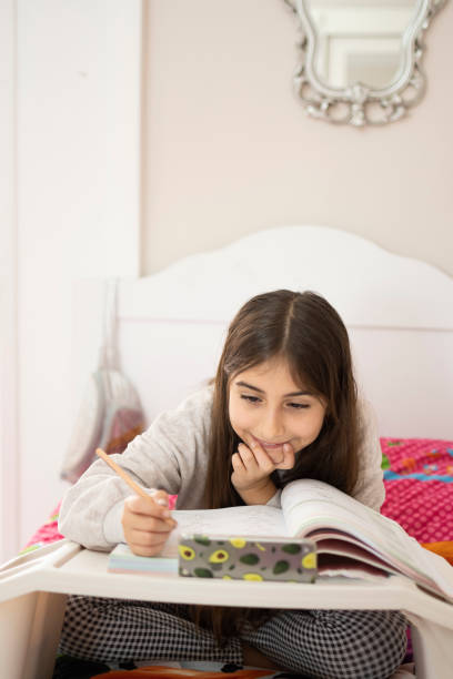 istock Littel girl education at home 1309071103