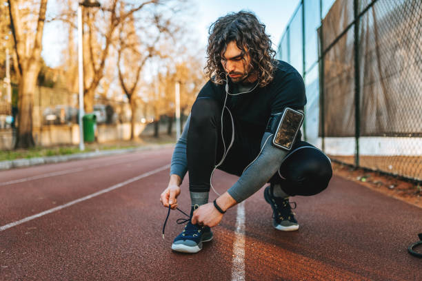 istock Leaning on fence - man sport 1309074523