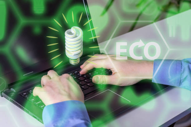 istock Hand use laptop computer with environment Icons over the Network connection on nature background, Technology ecology concept. 1309075429