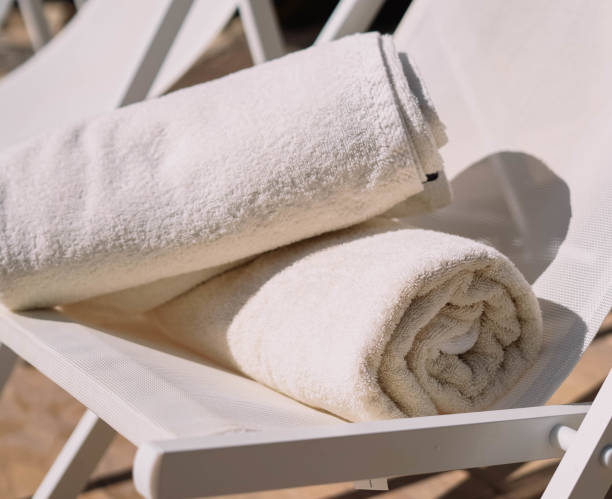 istock Hotel pool chair with folded towels 1309076473
