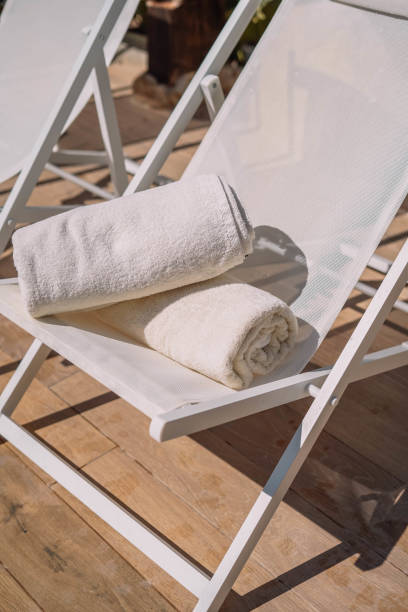 istock Hotel pool chair with folded towels 1309076486