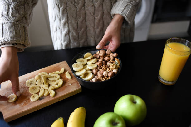 istock Woman making healthy breakfast in kitchen 1309079418