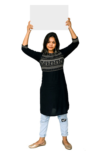 Young Indian woman holding blank placard, on white background.