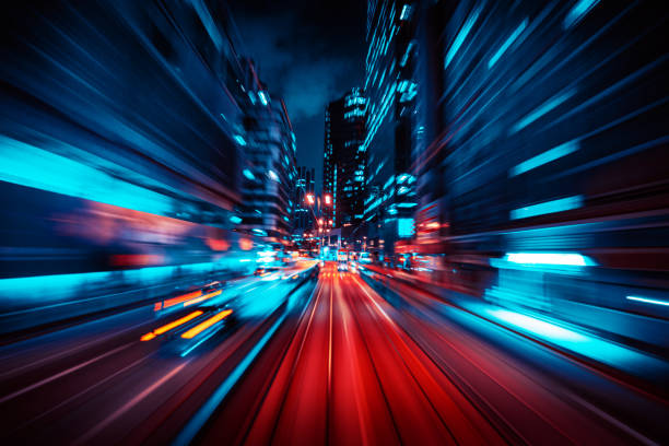 istock Motion Speed Light Tail with Night blurred City Background 1309080880
