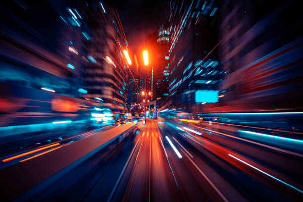 istock Motion Speed Light Tail with Night blurred City Background 1309080891