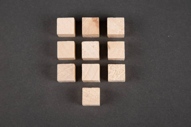 istock Wooden cubes on black background 1309081997