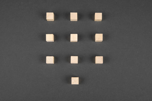 istock Wooden cubes on black background 1309082044