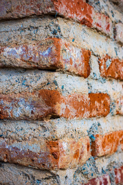 house wall corner. fragment of masonry of an old red brick wall - corner stone wall brick imagens e fotografias de stock