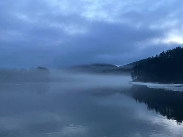 istock Mist over a lake at sunrise 1309084672