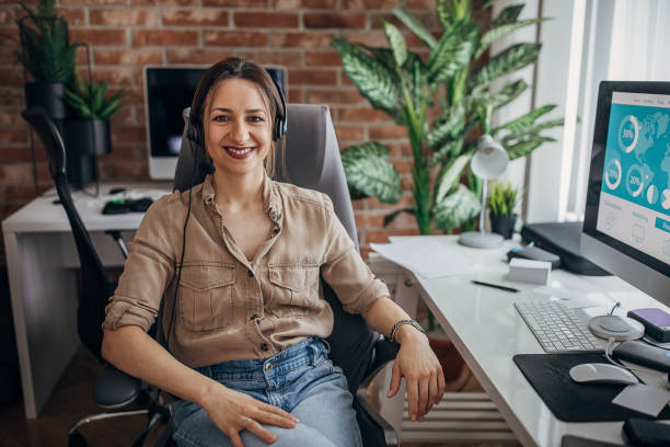 istock Woman sitting in office 1309084774