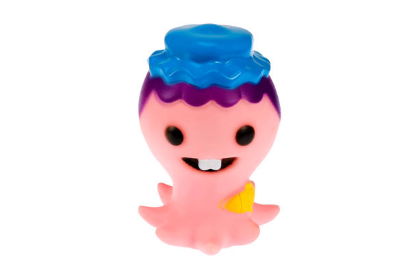 istock A toy octopus in a hat. On a white background, isolated 1309087780