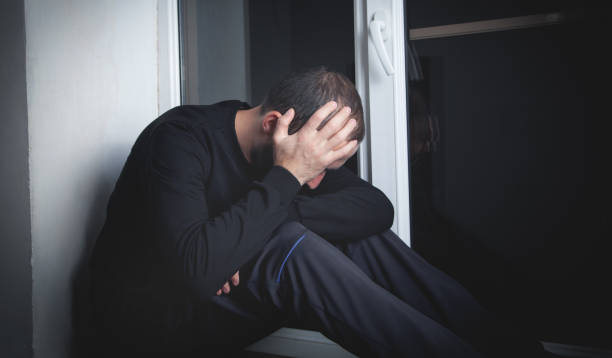 istock Caucasian sad and depressed man at home. 1309087895