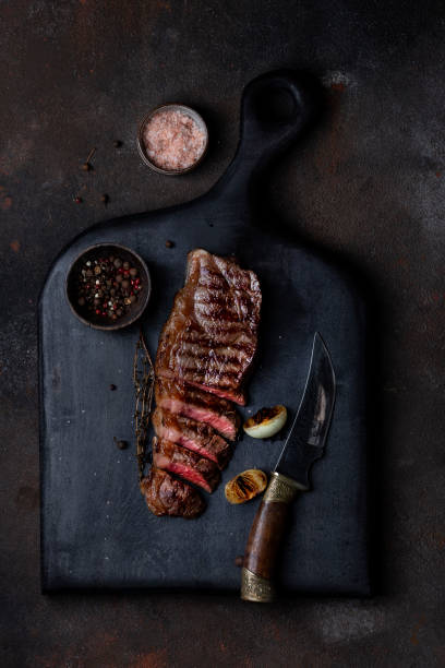 istock Sliced grilled beef barbecue Striploin steak with thyme 1309088093