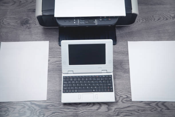 istock Xerox printer machine, laptop and papers on the desk. 1309088306