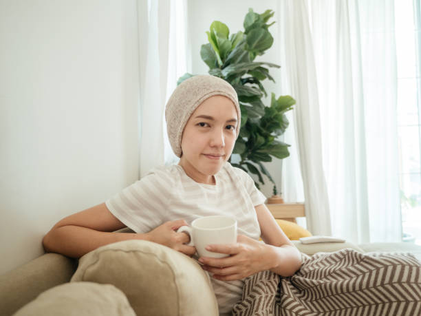 Happy woman with cancer drinking tea.