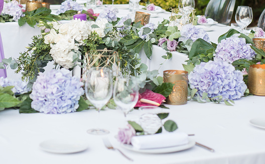 Elegantly decorated table for an outdoor wedding banquet