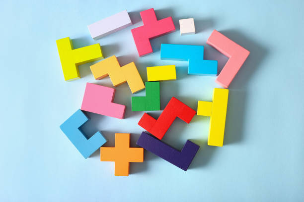 istock Multicolored puzzle, cubes on a blue background 1309096133