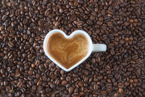 istock White cup shape heart of coffee on coffee beans 1309096591