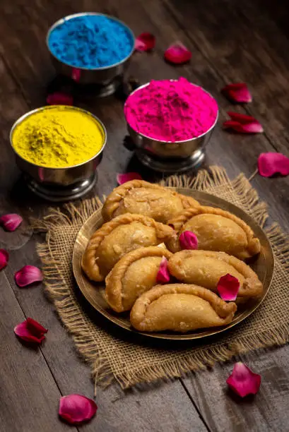 Gujiya , Pedakiya, a karanji  or Kajjikayalu  is a sweet deep-fried dumpling, native to the Indian subcontinent, 
made with semolina or Maida  stuffed with a mixture of sweetened khoya and dried fruits, and fried in ghee.