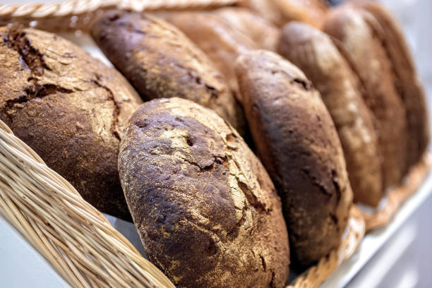 istock Loaves rye bread on shelf in market. Selective focus. 1309098719