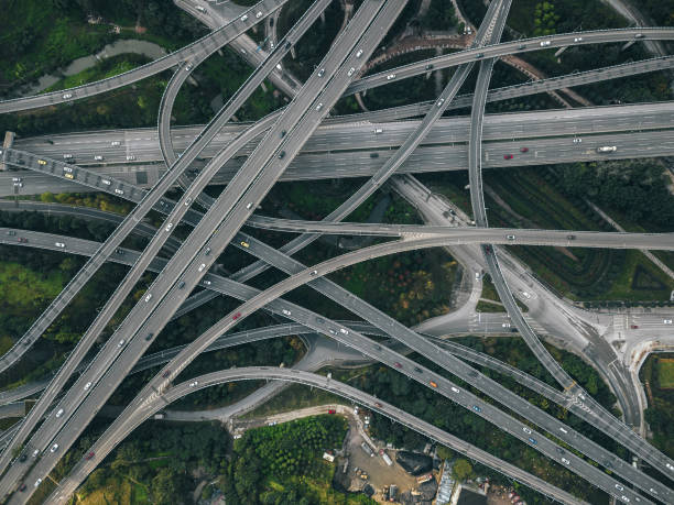 istock Aerial View of Complex Overpass and Busy Traffic 1309099045