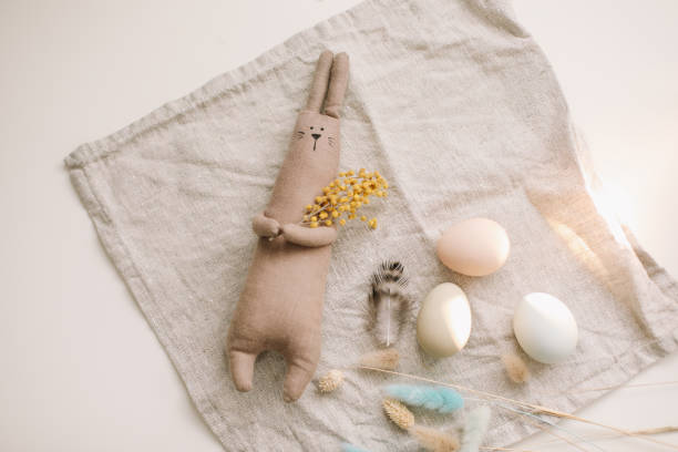 istock Happy Easter concept. Funny handmade bunny rabbit toy and chicken eggs 1309101051