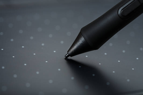 istock Graphic tablet with a pen working designer, close-up. Gadget for creativity and work of a photographer, Illustrator and art artist. 1309101824