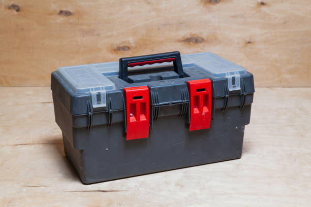 istock Tool box stands on wooden background 1309105593