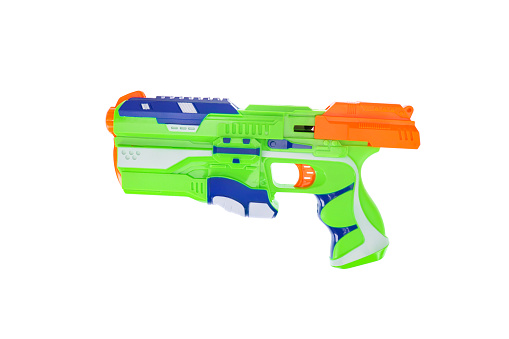 A green toy gun. On a white background, isolated