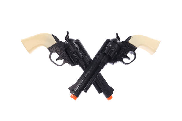 istock Two crossed black pistols. On a white background, isolated 1309105896